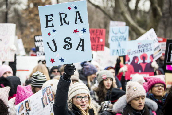 A marcher holds a sign that say, \"ERA USA\" during the Woman's March in New York City on Jan. 18, 2020.