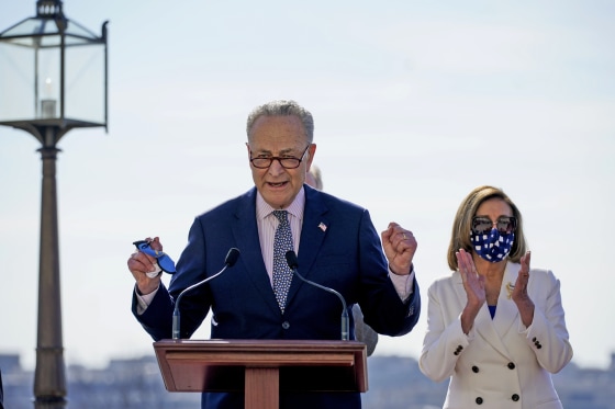 Image: Senate Majority Leader Chuck Schumer speaks before they sign the $1.9 trillion Covid-19 relief bill during a bill enrollment ceremony on the West Front of the Capitol on March 10, 2021.