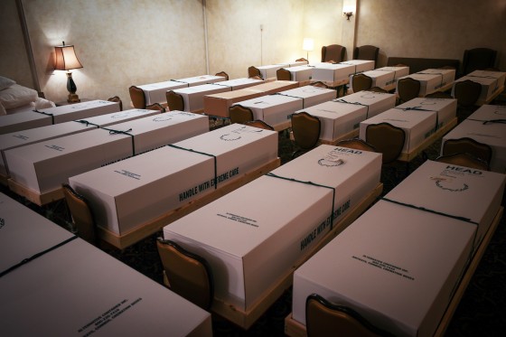 Caskets hold the bodies of people who died of Covid-19 sit inside the Gerard J. Neufeld funeral home in Queens, N.Y., on April 29, 2020.