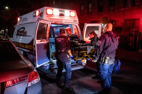 Empress EMS Capt. AJ Briones at an emergency scene as medics load a patient into an ambulance on April 22, 2020 in Yonkers, N.Y.