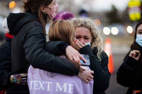 Image: People at the site of a mass shooting at King Soopers grocery store in Boulder