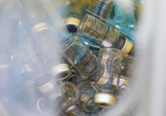 Image: Empty vials of the Sinovac Covid-19 vaccine fill a container at La Pintana Sports Complex, now a makeshift vaccination site in Santiago, Chile