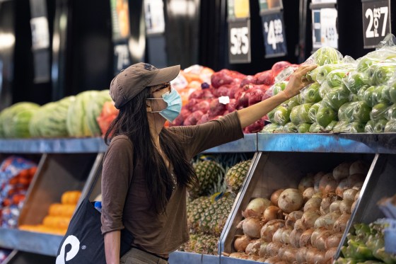 A woman shops at an outdoor supermarket on the Upper West Side in New York on Aug. 25, 2020.