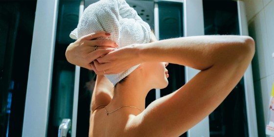 Woman with a microfiber towel in her hair