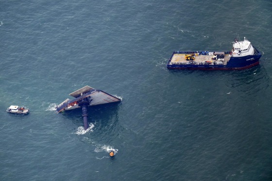 Image: Rescue boats are seen next to the capsized lift boat Seacor Power seven miles off the coast of Louisiana in the Gulf of Mexico on April 18, 2021.