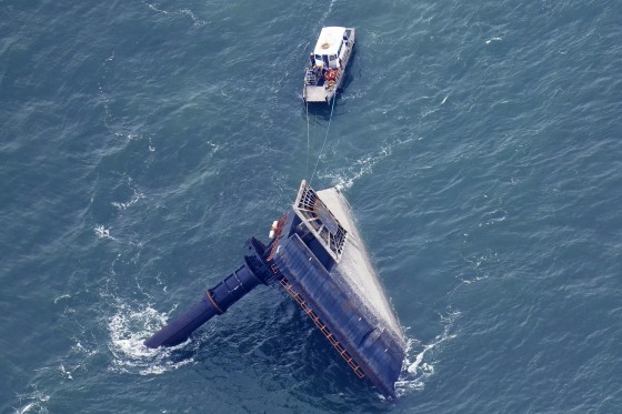 A rescue boat is seen next to the capsized lift boat Seacor Power seven miles off the coast of Louisiana in the Gulf of Mexico on April 18, 2021.