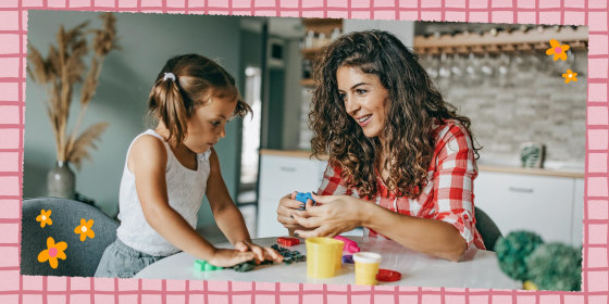 Mother and Daughter sitting at a table playing with a DIY kit