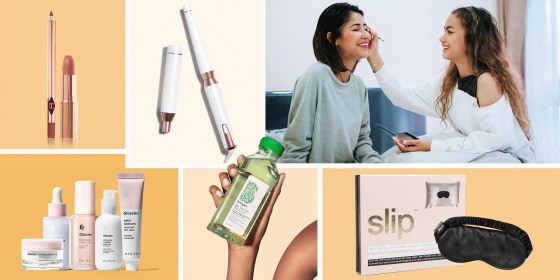 Illustration of a daughter putting makeup on her mother, Charlotte Tilbury Pillow Talk lipstick, Slip silk pillowcase with black mask, Glossier The Skincare Edit, T3 curling wand and BRIOGEO Superfoods Replenishing Shampoo & Conditioner Set