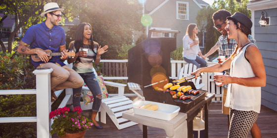 Friends enjoying barbecue on patio