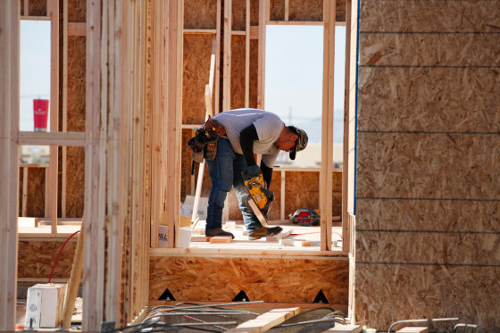 Image: A contractor cuts lumber