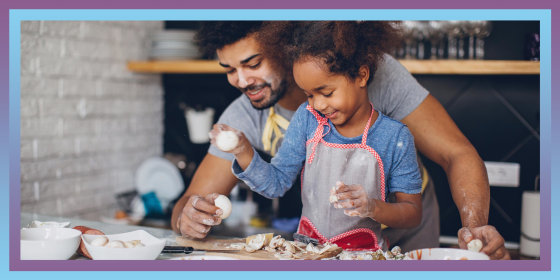 Father and daughter prepping food in the kitchen together