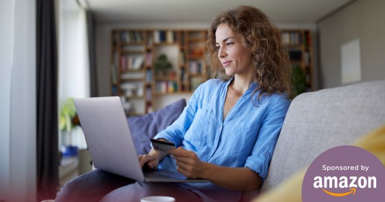 Woman shopping on her laptop in her living room
