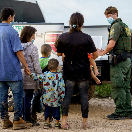 Image: Migrants are processed by the United States Border Patrol after crossing the U.S.-Mexico border into the United States in Penitas, Texas on July 8, 2021.