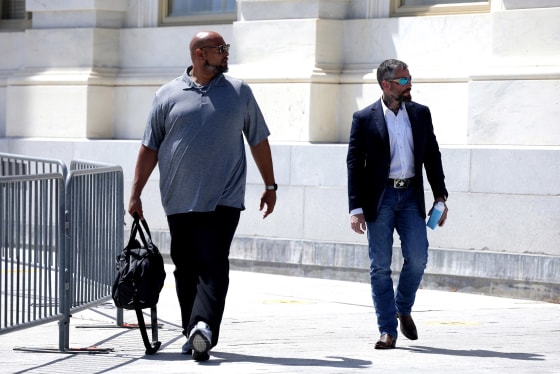Image: Metropolitan Police Officer Michael Fanone, right and U.S. Capitol Police Officer Harry Dunn depart from the U.S. Capitol after having a meeting with House Minority Leader Kevin McCarthy