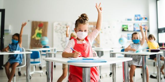 Image of Small children with face mask in school