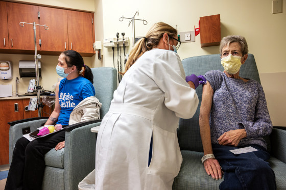 Image: A cancer patient receives a Covid-19 vaccine in an oncology unit at the James Graham Brown Cancer Center on April 2, 2021 in Louisville, Ky.