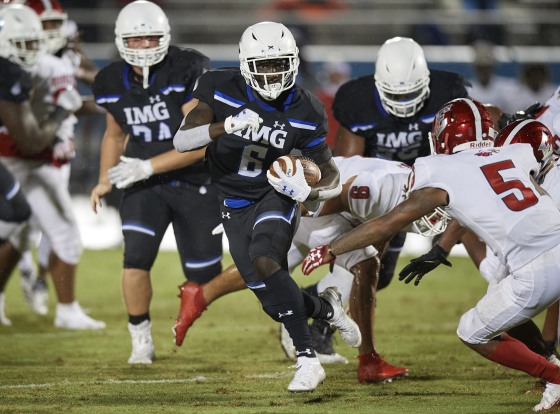 Image: IMG Ascenders running back Lovasea' Carroll (6) runs up field during a Varsity football game against the Edgewater Eagles on Sep.,17, 2020 in Bradenton, Fla.
