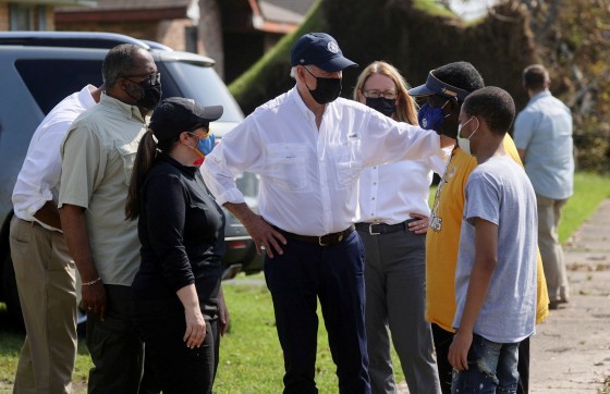 Image: Biden tours a neighbourhood hit by Hurricane Ida