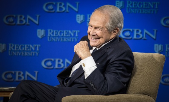 Image: Rev. Pat Robertson listens as Republican presidential candidate Donald Trump speaks at Regent University in Virginia Beach, Va., on Feb. 24, 2016.