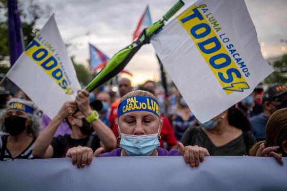 Image: Protesters march along Las Americas Highway to demand the expulsion of power company Luma amid a continued lack of electricity across the island, in San Juan, Puerto Rico on Oct. 15, 2021.