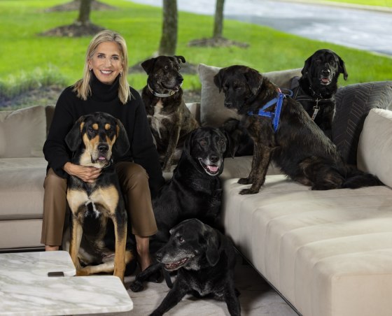 Cathy Bissell, founder of BISSELL Pet Foundation, with her adopted rescue dogs Roxy, Taz, Mo, Zoey, Hank and Lexi.
