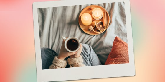 Image of person with mug and candles