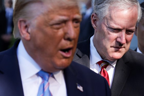 President Donald Trump speaks as White House Chief of Staff Mark Meadows listens on July 29, 2020 in Washington.