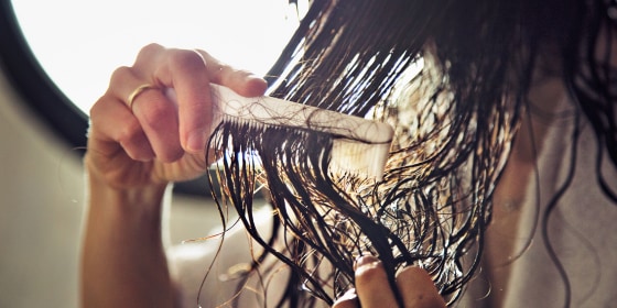 Woman combing her hair