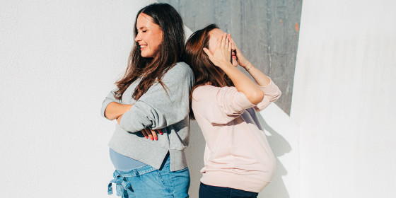 Two pregnant woman outside