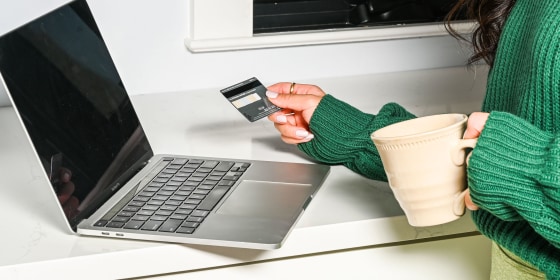 Woman on her credit card shopping online