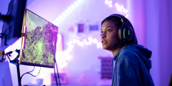 Woman looking at a gaming monitor