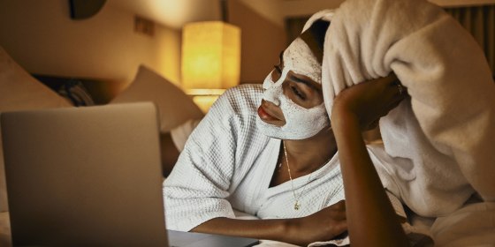 woman relaxing at home using laptop