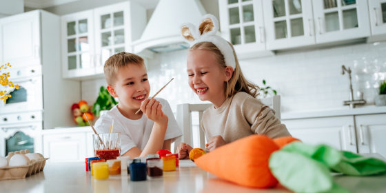 children playing paint themselves with paints
