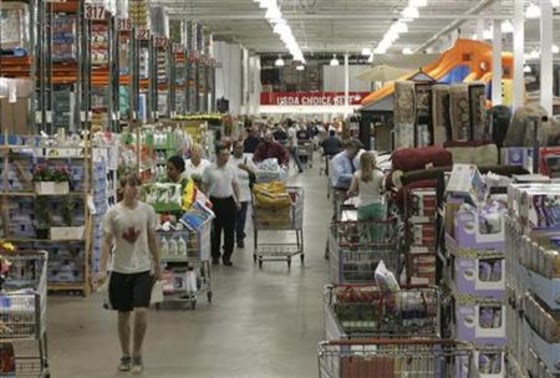 Shoppers work their way through a Costco warehouse store in Arlington, Va.
