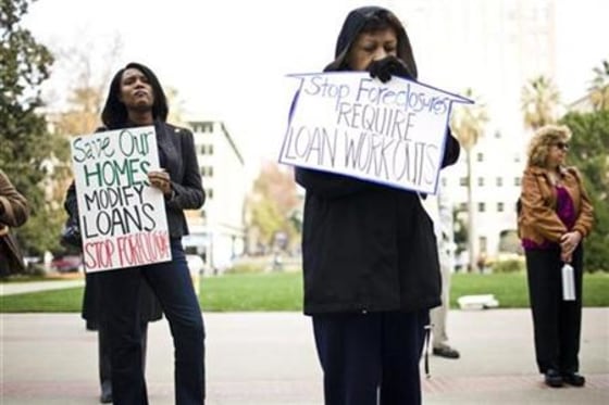 Carmen Fernandez and others rally to ask state lawmakers to stop home foreclosures and help modify loans at the State Capitol in Sacramento