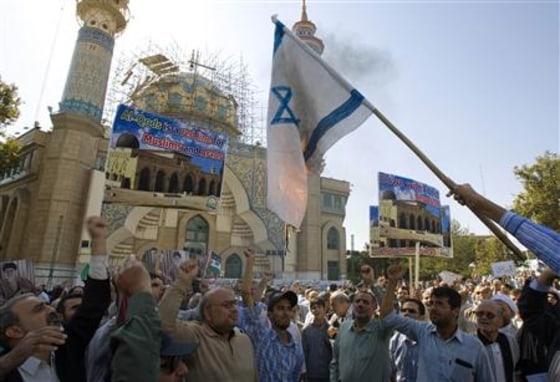 Iranian worshippers burn Israel flag during a demonstration in Tehran