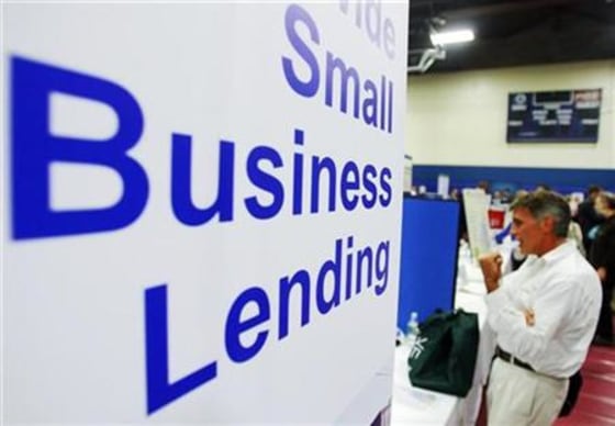 Current and prospective small business owners talk to vendors with information about state, federal, and private funding resources at a Small Business Financing Fair in Manchester