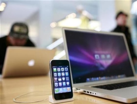 An Apple iPhone 3GS and an Apple Macbook Pro are shown at the Apple retail store in San Francisco