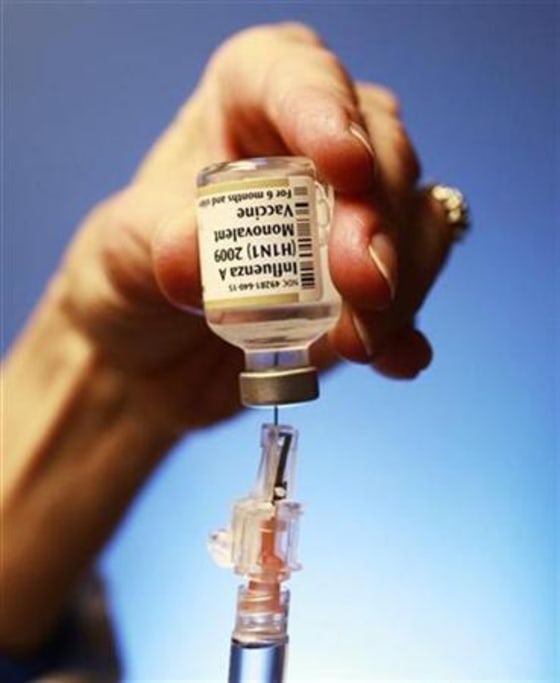 Registered nurse Susan Longobucco-Hynes prepares a dose of the H1N1 swine flu vaccine for patients at an Asthma fair at Children's Hospital in Boston