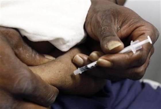 A diabetic patient injects himself with insulin