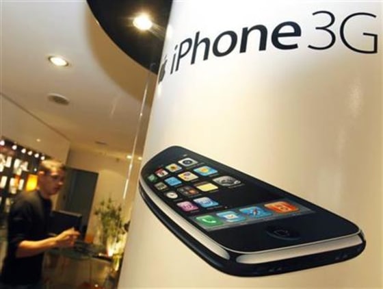 Advertisement for the Apple iPhone is displayed at a retail store of an Orange mobile phone network provider in Bordeaux