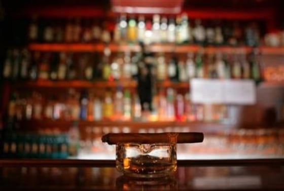 A left behind cigar is seen in front of the bar inside a restaurant in Hanau near Frankfurt