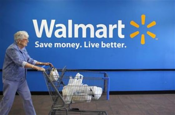 A customer leaves a Wal-Mart store in Rogers