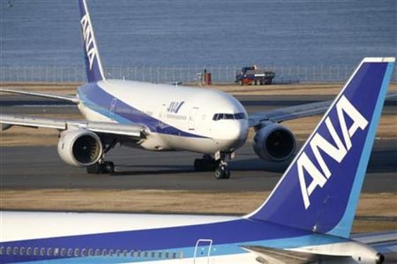 Aircraft of ANA taxis along the runway at Haneda airport in Tokyo