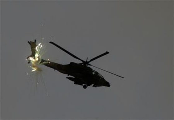 An Israeli Apache helicopter fires flares over the northern Gaza Strip
