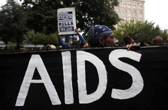 AIDS activists demonstrate with mock coffins near the site of the G20 Summit in Pittsburgh