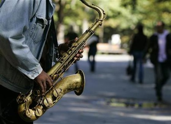 A man plays the saxophone in Central Park