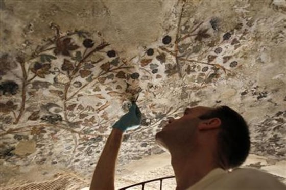 British conservation specialist restores Hellenstic style wall paintings in a cave complex in Beidha