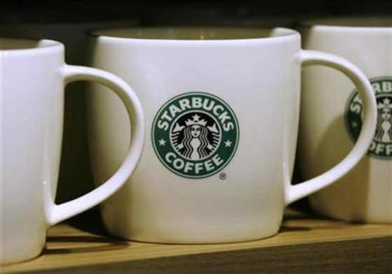 Cups are displayed at a Starbucks restaurant in Hong Kong