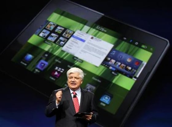Mike Lazaridis, president and co-chief executive officer of Research in Motion, holds the new Blackberry PlayBook at the RIM Blackberry developers conference in San Francisco